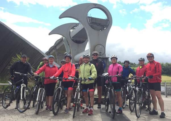 The team at the halfway point at the Falkirk Wheel of the 66-mile cycle ride