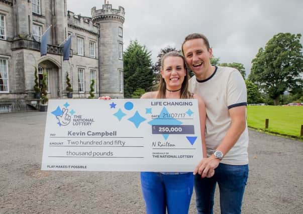 Scratchcard winner Kevin Campbell from Denny and girlfriend Sarah McDougall. Picture: Alan Peebles
