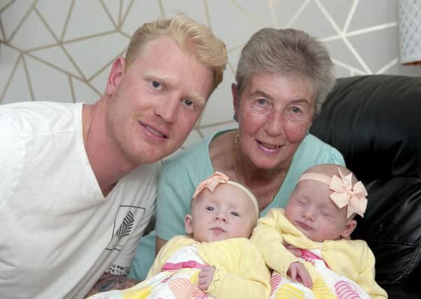 Dad Ryan, great-gran Gladys with Olivia, left, and Grace Nimmo who were all born on May 26