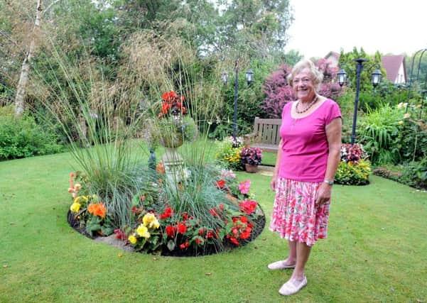 Malvina Dwyer invites visitirs into her beautiful garden to rais emoney for charity