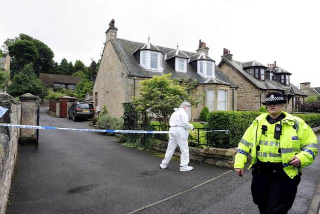 Police carry out investigations after the body of Arnold Mouat, inset, had been found in his home in Boness. Picture: Michael Gillen