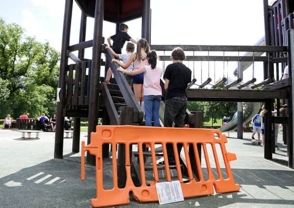 Children have been playing on the play equipment in Callendar Park despite warning signs and a barrier. Picture: Michael Gillen