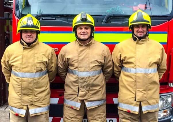 Denny firefighters Darren Ryan, David Ansley and Derek Dalrymple who scaled Ben Nevis to raise funds for FDAMH