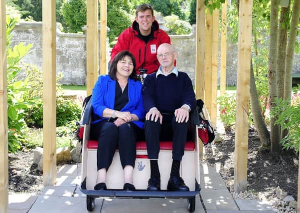 Fraser Johnston, back, with Social Security Minister Jeane Freeman and Burnbrae Care Home resident Wiillie Kerr. Picture: Michael Gillen