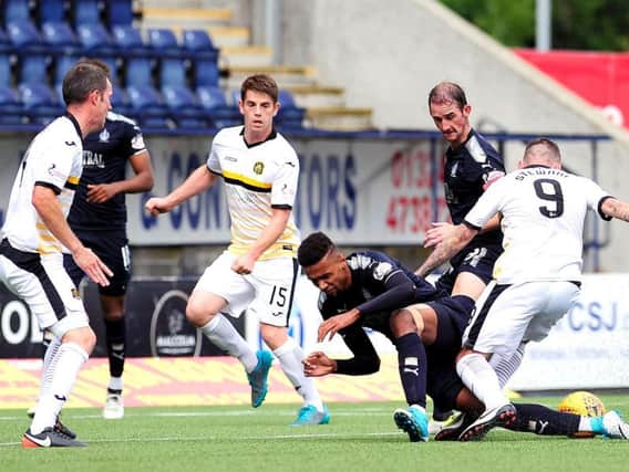 Nathan Austin is fouled for the Falkirk penalty (pic by Michael Gillen)