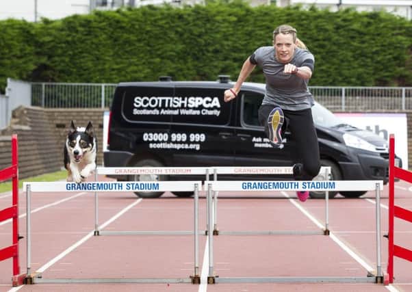 Eilidh Doyle and Bran get the SSPCA campaign off the ground. Picture: Peter Devlin