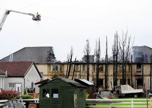 Firefighters used two aerial platforms to tackle the blaze which badly damaged the care home where over 50 elderly and vulnerable people were residents. Picture: Michael Gillen