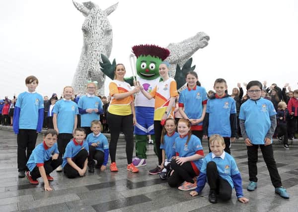 Athletes Jennifer and Seonaid McIntosh, Team Scotland mascot Clyde and the baton bearers from St Francis Xavier's and Victoria primary schools. Picture: Michael Gillen