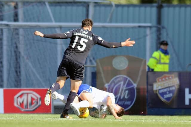 Luca Gasparotto conceded a penalty for this foul - before scoring Falkirk's consolation goal. Picture Michael Gillen.