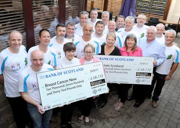 The cheque presentation at Behind the Wall with the Round Table and 41 Club handing over Â£10,732 to each charity