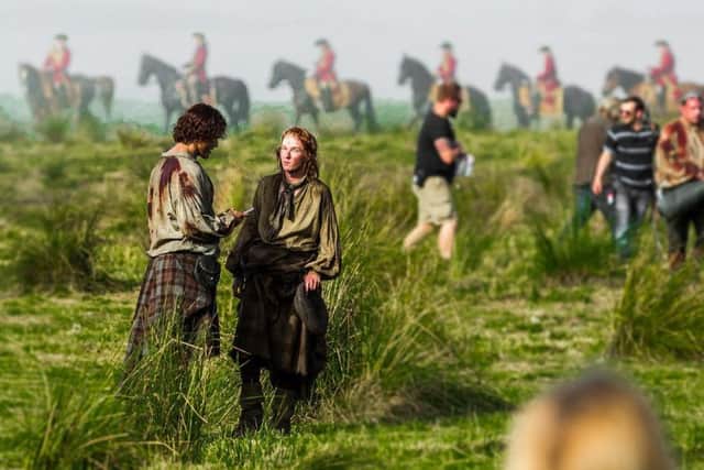 This scene from Outlander showing film crew and actors at the site of the Battle of Culloden was actually shot in a field minutes from Cumbernauld shopping centre.
