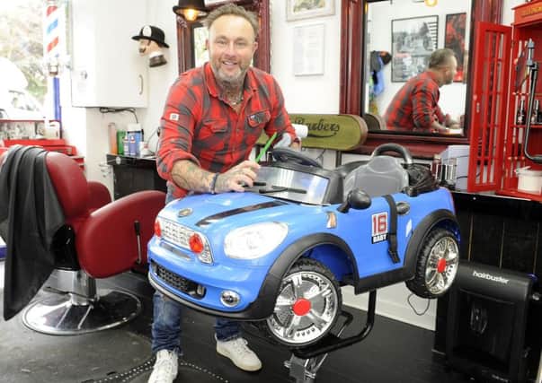 Barber Mark Fleming is holding special haircutting days at his shop Markys in Grangemouth for autistic children