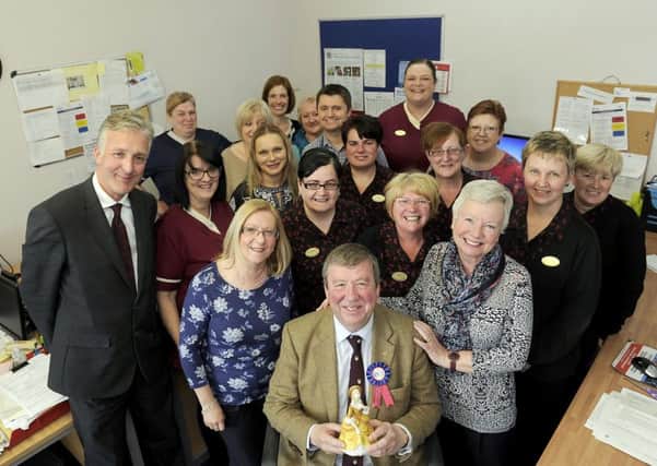 Dr Ian Murdoch and his wife Catherine, right, surrounded by colleagues as he retires after 33 years. Picture: Michael Gillen