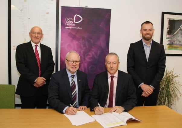 Forth Valley College principal Dr Ken Thomson and Hector Macaulay, managing director of Balfour Beatty in Scotland, sign the official construction agreement for the new Falkirk campus