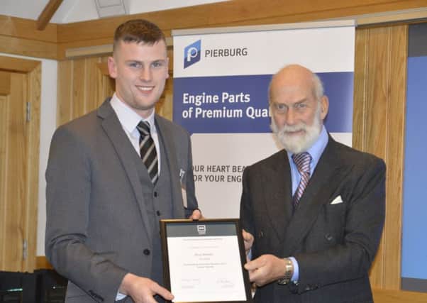 Scania apprentice Rory Whelan with Prince Michael of Kent