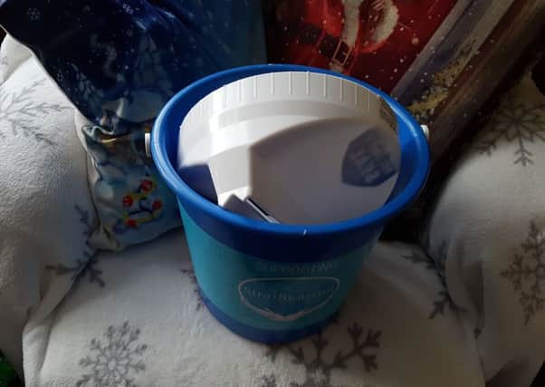 Brian Wilson's Christmas Lights charity bucket for Strathcarron Hospice, which was chained up in Dryburgh Avenue, Denny was forced open and thieves pinched the money that was inside