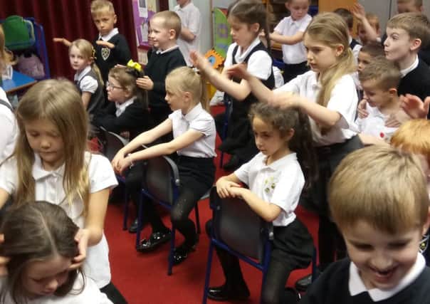 Pupils at Dunipace Primary School take part in the Massage in Schools Programme - MISA