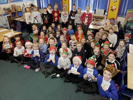 Stenhousemuir Primary School pupils show off copies of their new album - Christmas Under the Sea