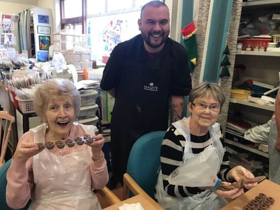 Michael Maley, of Maley's Chocolates, visited Strathcarron Hospice in December 2017 to make chocolates with the hospice's day service patients.