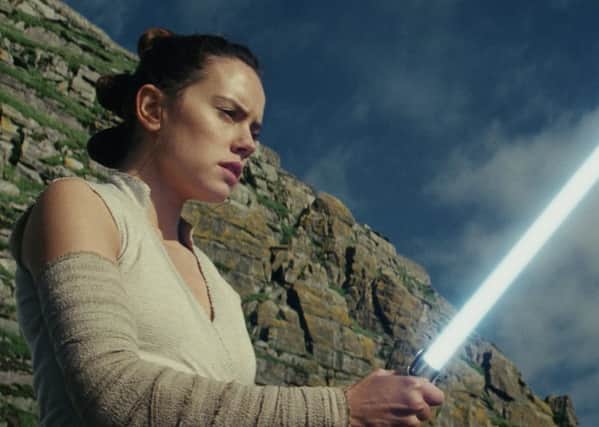 This image released by Lucasfilm shows Daisy Ridley as Rey in "Star Wars: The Last Jedi" (Lucasfilm via AP)