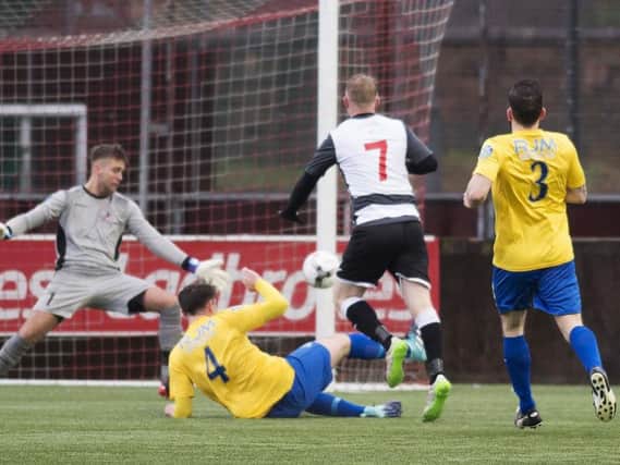 Andy Rodgers fires home East Stirlingshire's opener against Cumbernauld Colts (pic by Craig Halkett)
