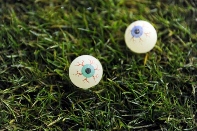 Rubber bouncing balls were thrown onto the pitch. Picture Michael Gillen.