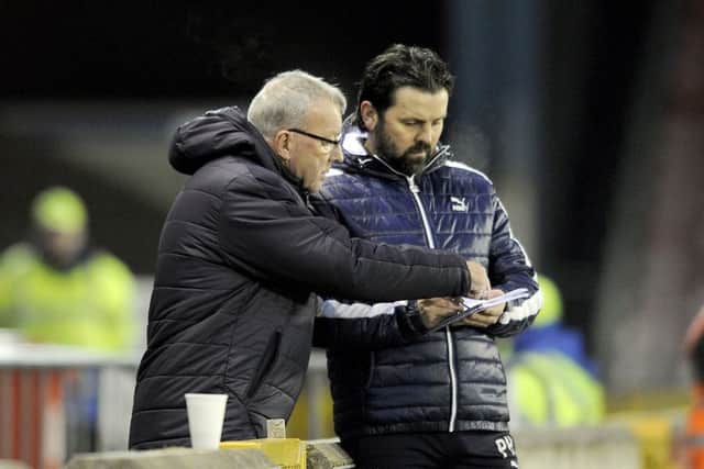 Alex Smith has stepped back into the dugout to help Paul Hartley. Picture Michael Gillen