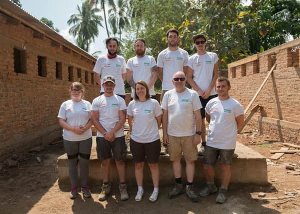 Connor Hanlor, first left, top row, volunteering with Raleigh International in Tanzania