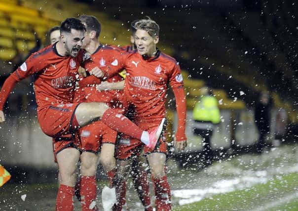 Reghan Tumilty celebrates his stoppage-time winner at Livingston (picture by Michael Gillen)