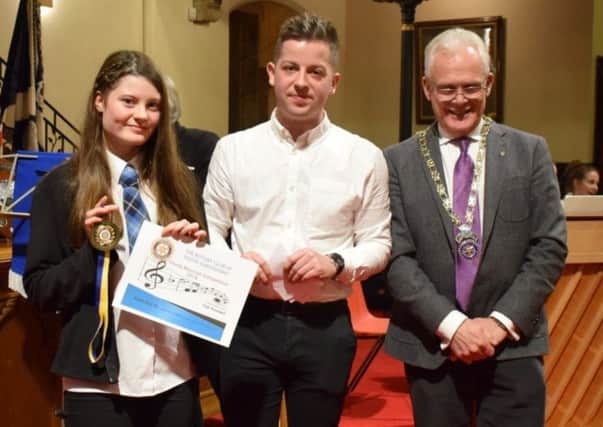 First place for musician Laurie Whike, pictured with judge Aaron Calder and Queensferry Rotary Club president Neil McKinlay. (Contributed image)