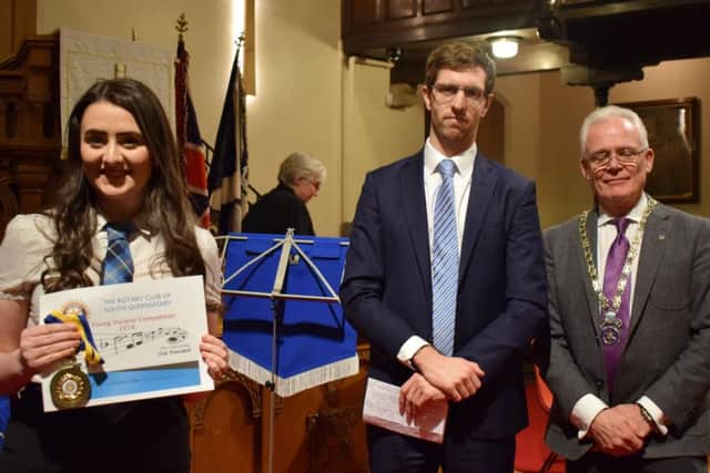 First place for vocalist Kathryn Hope, pictured with  judge Stephen Dennis and Queensferry Rotary Club president Neil McKinlay. (Contributed image)