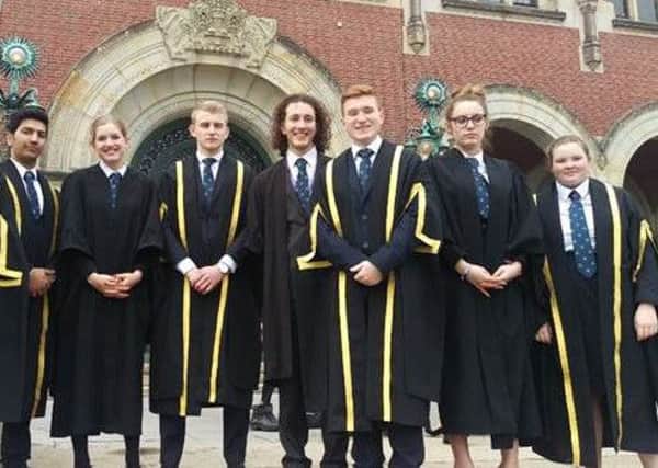 Falkirk High pupils Aaron Laurie (fourth from right) and Scott Richardson-Peat (third from left) with other Scottish pupils who took part in a mock international court project in The Hague