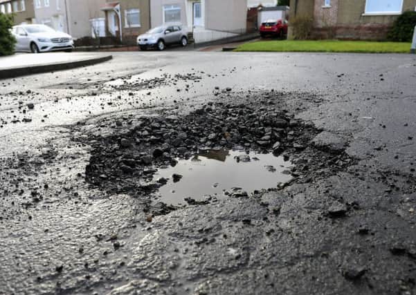 Potholes, such as this one one on the corner of Falkirk's Bantaskine Road and Windsor Avenue, are a growing problem