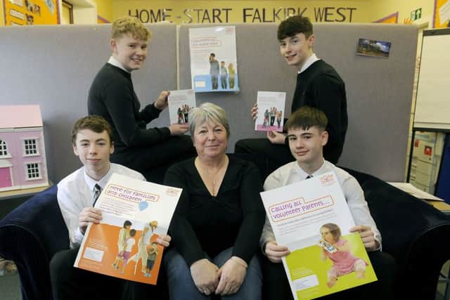 Denny High pupils Logan Morton (back left), Andrew Donnelly (back right), Daniel Bruce (front left) and Josh Brown with Sandra Rankin, of Home-Start
