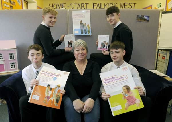Denny High pupils Logan Morton (back left), Andrew Donnelly (back right), Daniel Bruce (front left) and Josh Brown with Sandra Rankin, of Home-Start