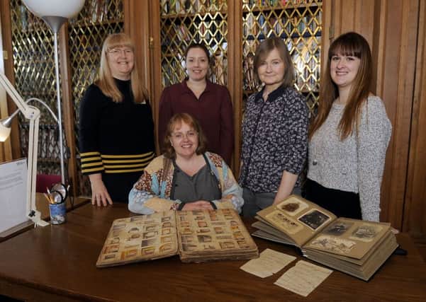 Archivist Elspeth Reid (seated) with (left to right)  Margaret                                         McLeish, archives assistant; Jen Faichney, graduate trainee researcher; Jean Jamieson, archives assistant; and Katie Stewart, archives assistant