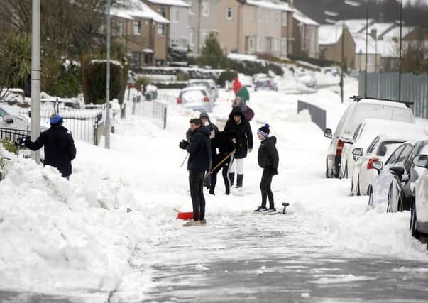 A typical street scene from Falkirk yesterday, with residents starting  to make an impact on the snow.  Outlying villages often weren't so lucky.  Picture, Michael Gillen.