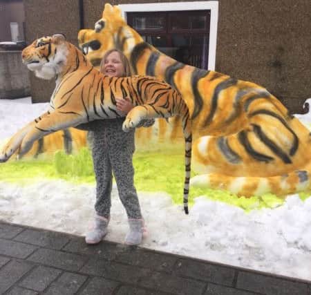 Tiger fanatic Fee Robertson was delighted with the snow tiger her family created in Dock Street, Carronshore