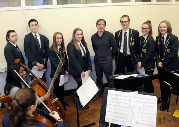 Magnificent seven...composers from St Mungos High School in Falkirk with mentor, Colin Broom. (Pic: Michael Gillen)