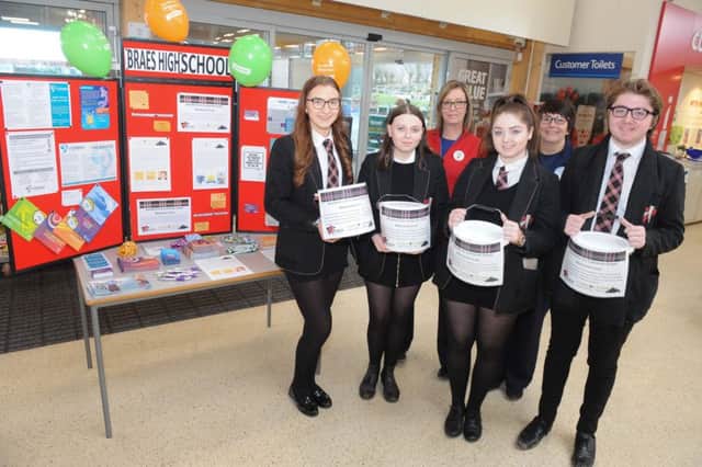Braes High pupils gathered with Tesco staff after raising cash for the Cameron Grant Trust