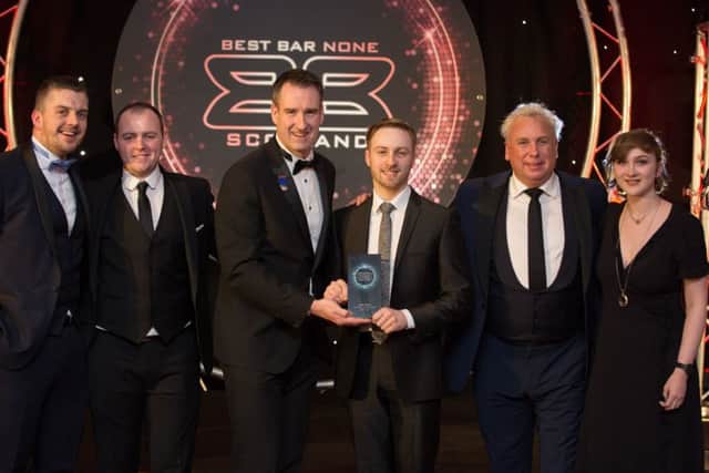 The platinum-winning team at Sportsters, Falkirk.  Left to right Iain Meiklejohn (general manager), Ross Dougall, award presenter John Hutchison from Heineken, Jack Mitchell, Gus Michael and Kerry Swan.