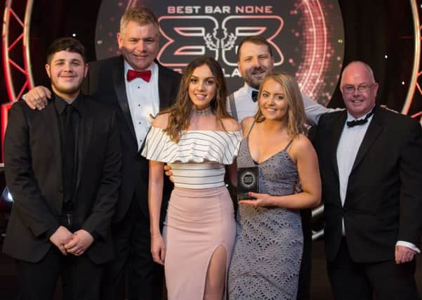 The platinum-winning team at Falkirk's Behind the Wall.  Left to right - Gregor Stirling, Brian Flynn, Ellie Moyes, Bobby Galloway and (from Chivas Brothers/Pernod Ricard) Jack Gemmell, who presented the award.