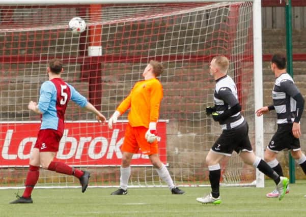 Andy Rogers chips home Shires second in Saturdays win over Whitehill Welfare in their final home league game at Ochilview.