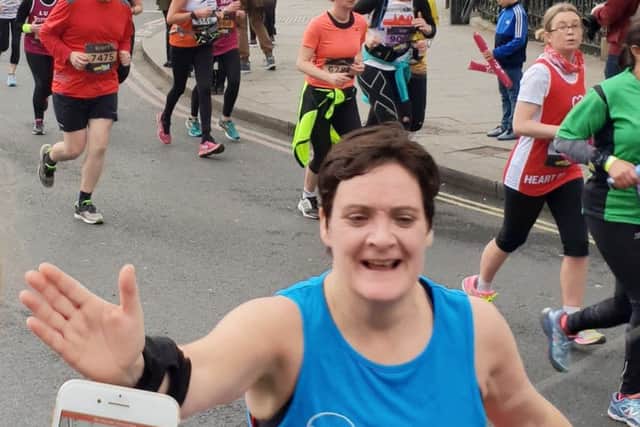 Mission accomplished - Louise reaches the finish line of the half marathon she entered to raise funds in memory of her sister Anne