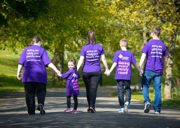 Helping hand...is needed by the Falkirk branch of Alzheimer Scotland which is appealing for more volunteers to raise awareness and funds.  (Pic: Nick Ponty)