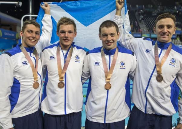 Six-time medallist Duncan Scott (second left) and Kieran McGuckin (second right) helped the 4x100 metres relay team to bronze (pic by JSHPIX.CO)