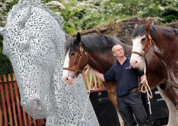 Andy Scott with the master sculpture for one of the giant Kelpies that were to follow - and some inspirational Clydesdales.