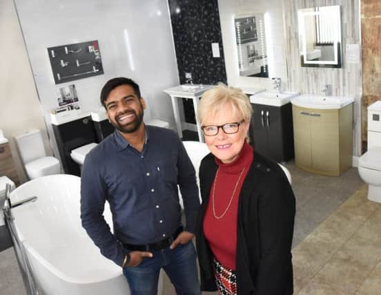 Alison Sime, managing director of FBS Plumbing with the company's intern Akshay Singh.