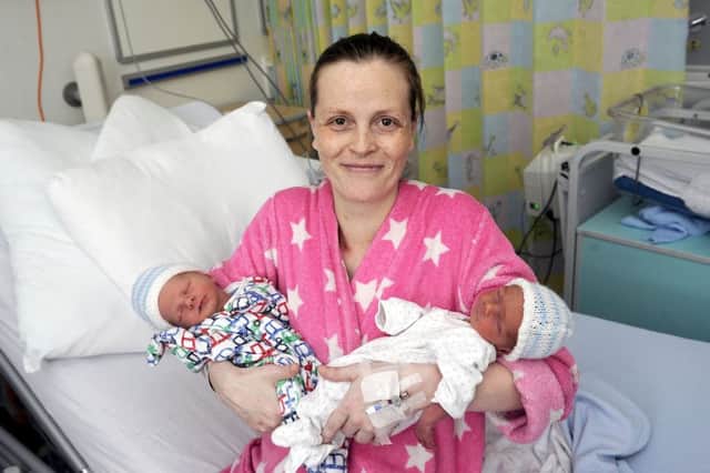 Janine Hogg with her twin boys, born just minutes before the Royal arrival
