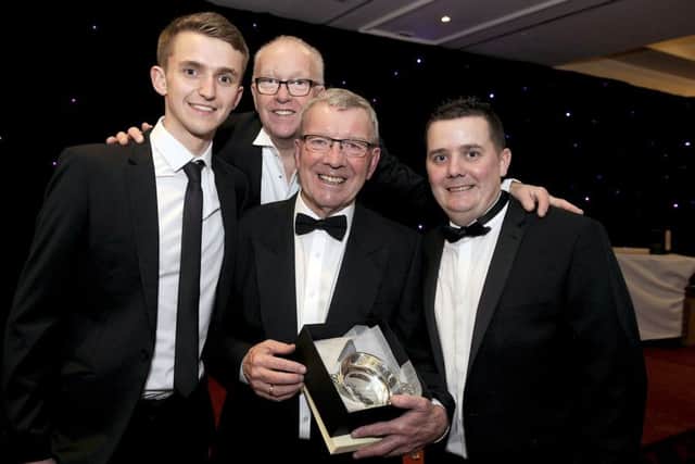 Falkirk FC matchday backroom team members Andrew Lauder, Ian Kerr and Kenny Stoddart congratulate Alex Smith on his Outstanding Contribution Award from the club. Picture Michael Gillen.